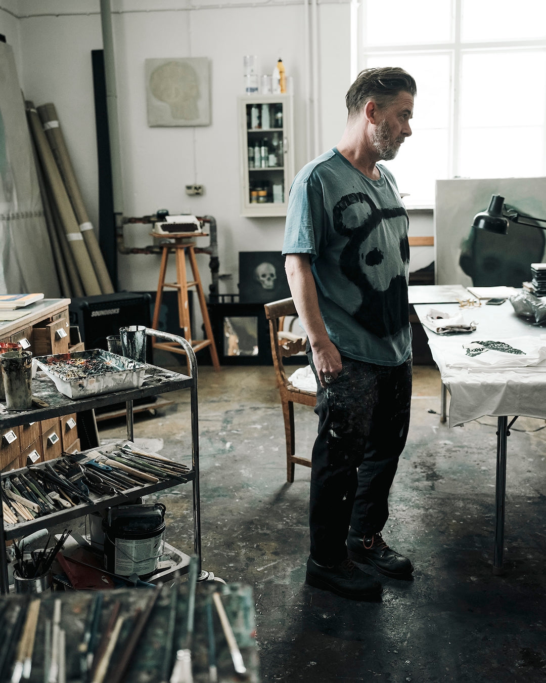 Jesper Waldersten standing in his studio with art supplies