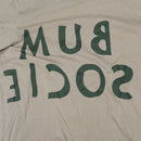 Close up reversed Bum Society logo print color:mud