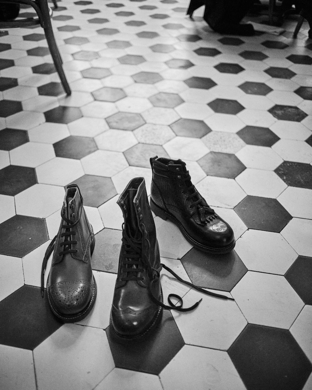 Bum Society boots on hexagon floor