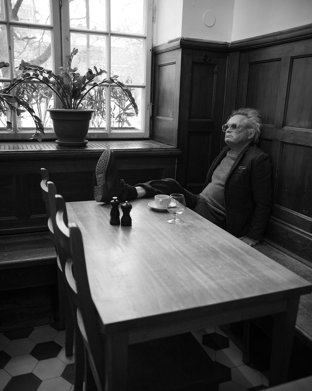 Claes Bondelid sitting by a window at a table Pelikan Stockholm