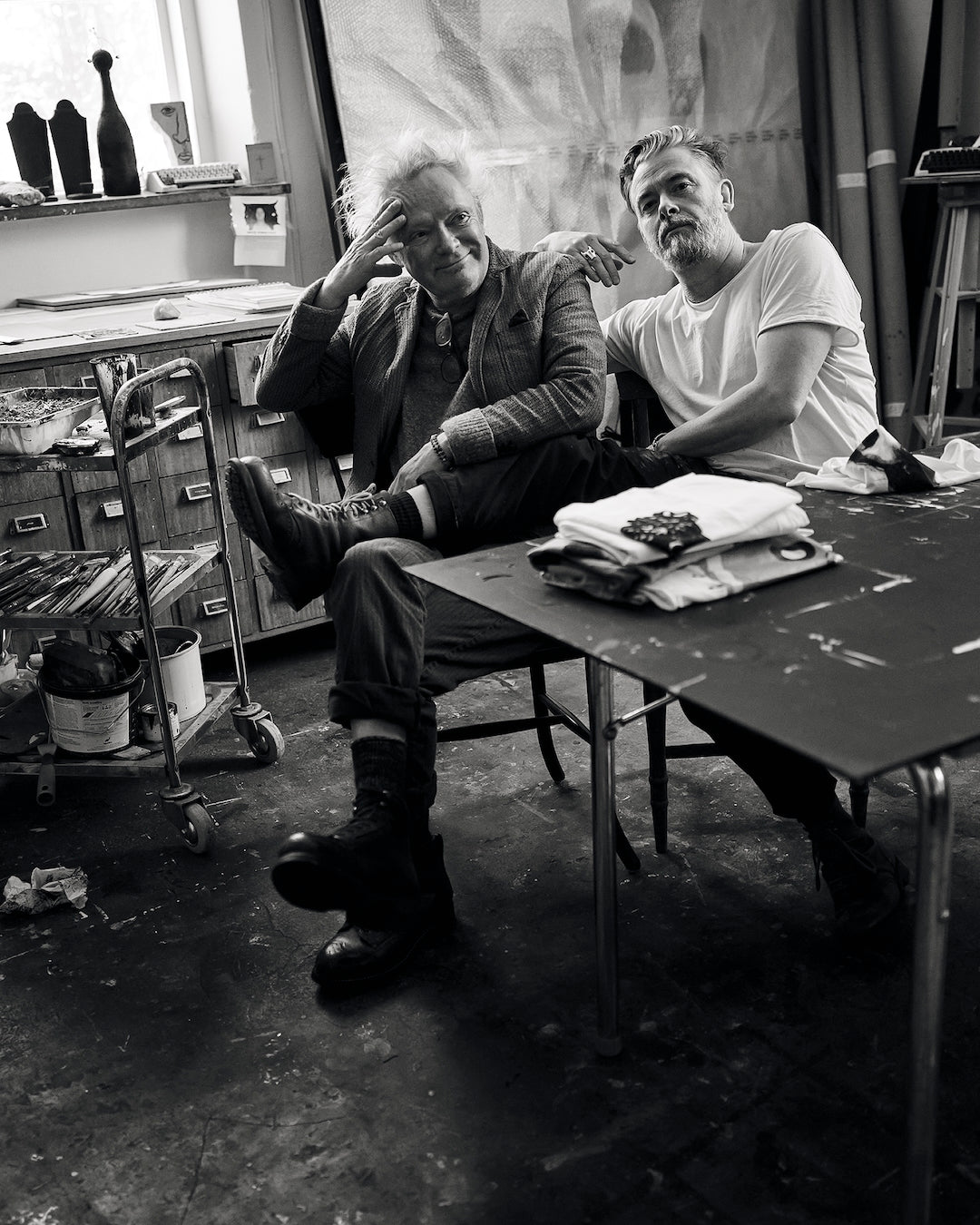 Claes Bondelid and Jesper Waldersten sitting at a table in the art studio