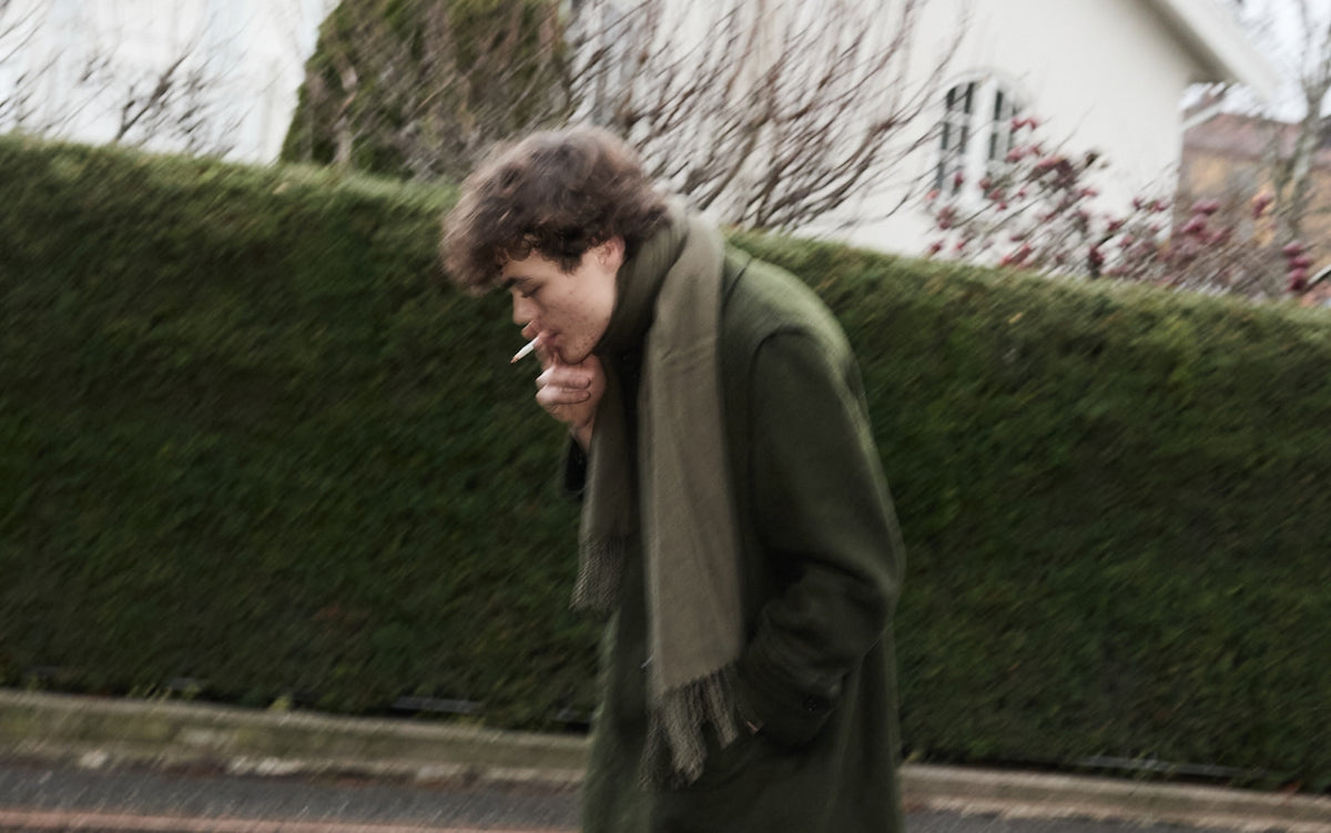 Alex in music band Diset smoking