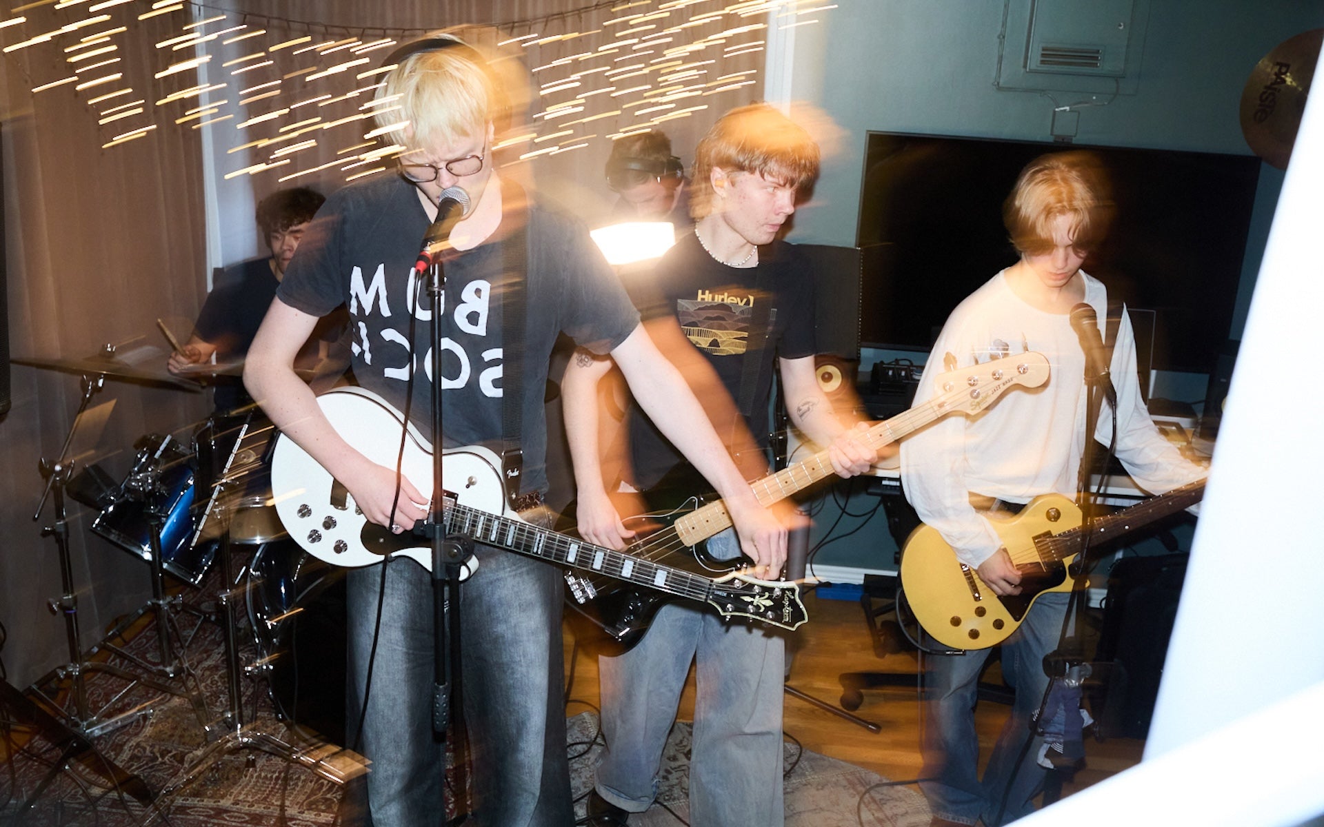 Music band Diset rehearsing in studio Agaton Gadd in Bum Society t-shirt