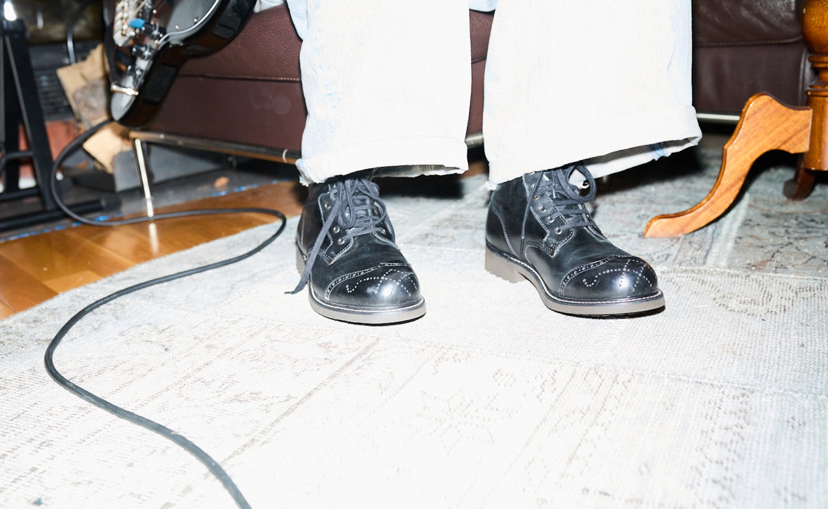 Bum Society boots close up during rehearsal with Diset