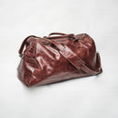 Bum Society leather duffle bag Lucky Brown side angle color:lucky brown