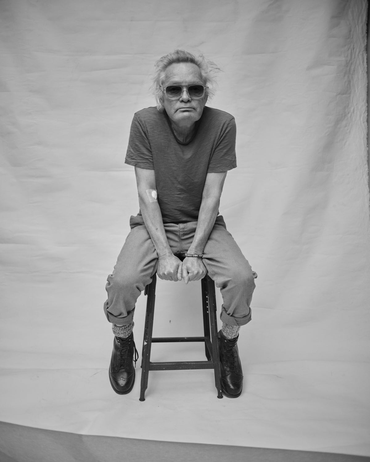 Claes Bondelid sitting on a stool against a plain background