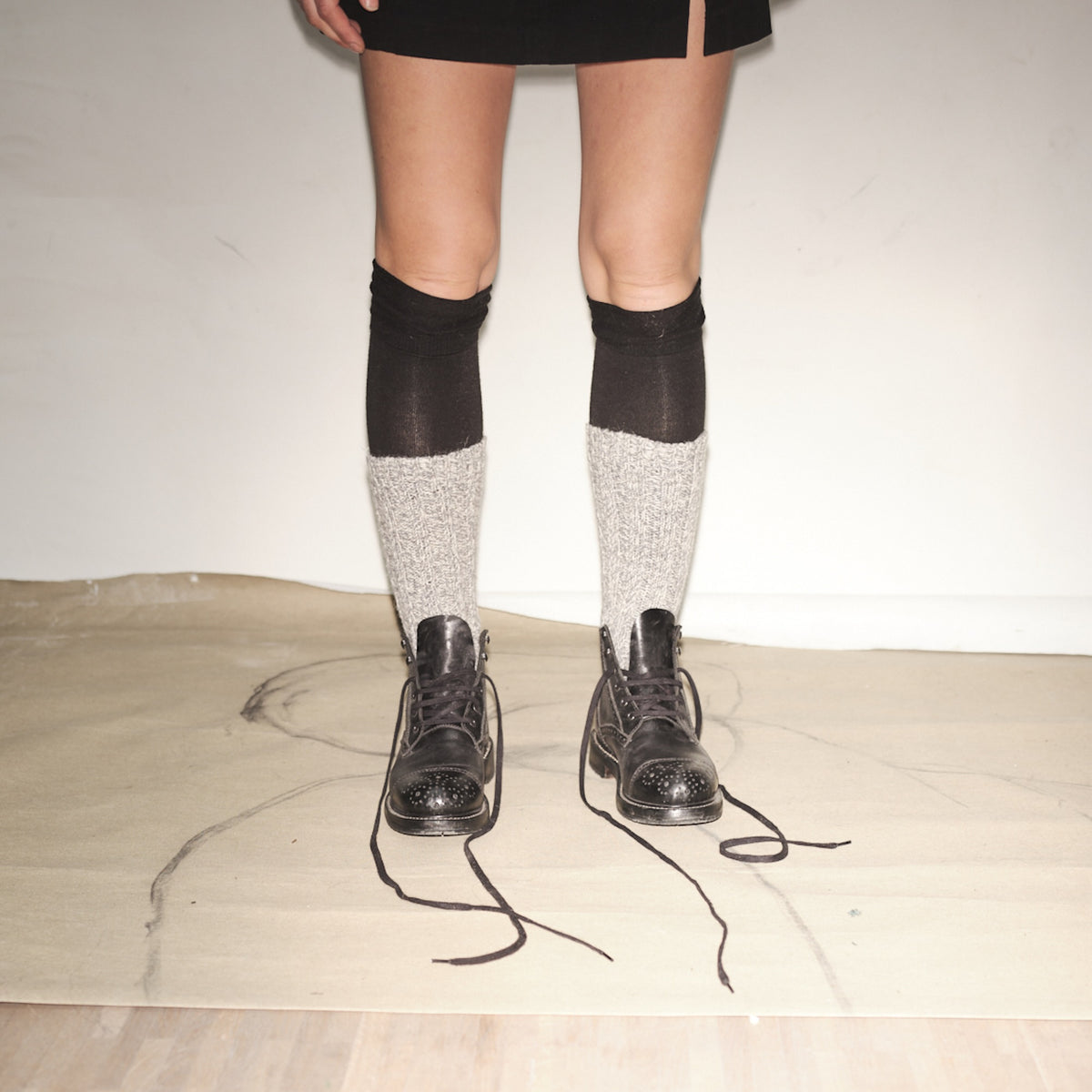 Person wearing black knee-high socks with white patterns and Bum Society Ruby Thursday boot Shiny Black color:shiny black