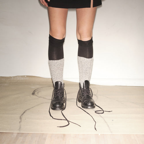 Person wearing black knee-high socks with white patterns and Bum Society Ruby Thursday boot Shiny Black color:shiny black