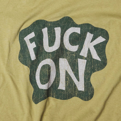 Close up cracked Fuck On print on Bum Society t-shirt Ongoing color:earth