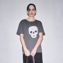 Person wearing a dark gray t-shirt with original Waldersten x Bum Society print Cry Baby color:ink