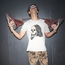 Person holding a pair of Bum Society boots in a t-shirt with original artwork Lady Dead by Waldersten for Waldersten x Bum Society collaboration  against a dark background color:mud