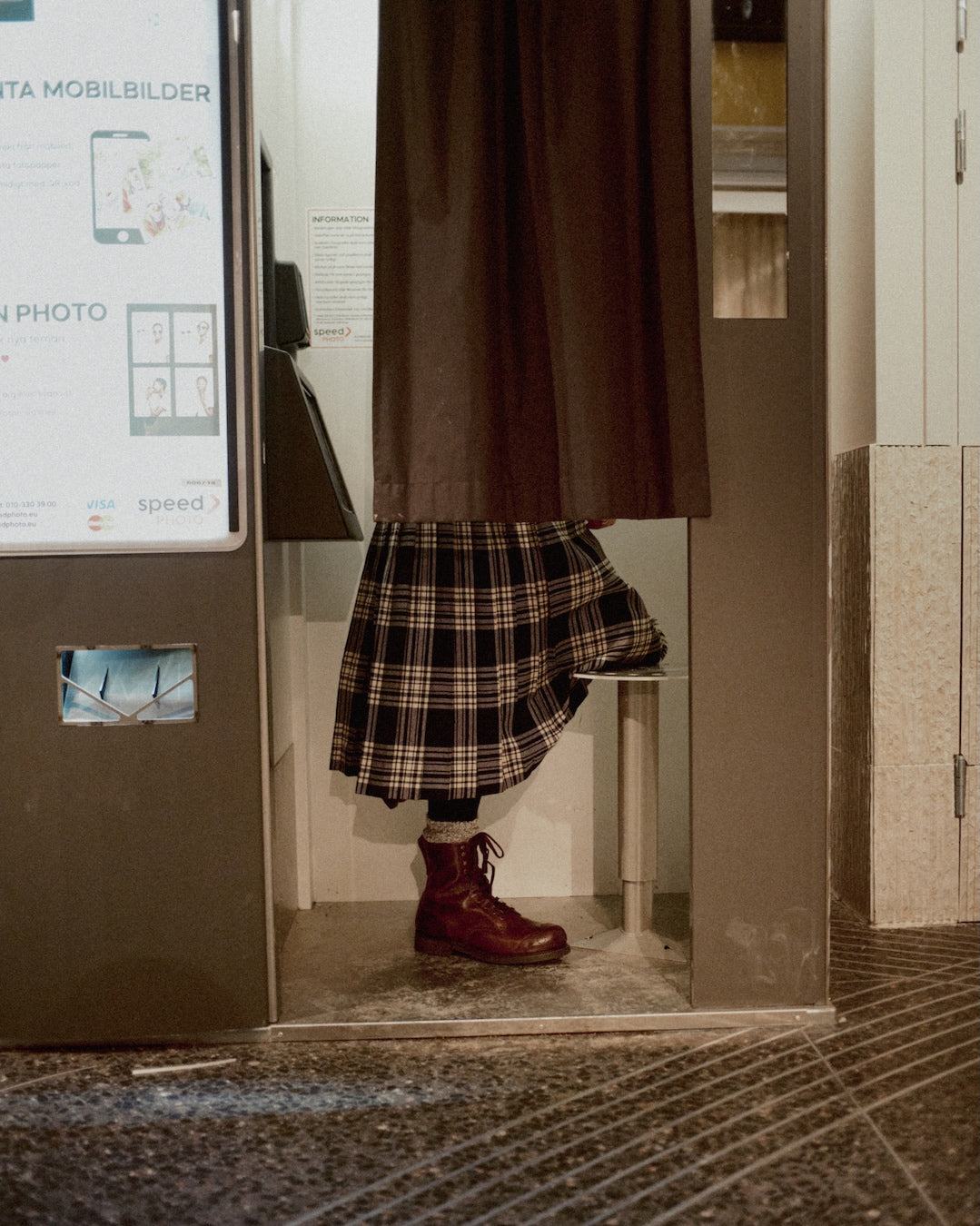 Photobooth session facing backwards plaid skirt Bum Society boots