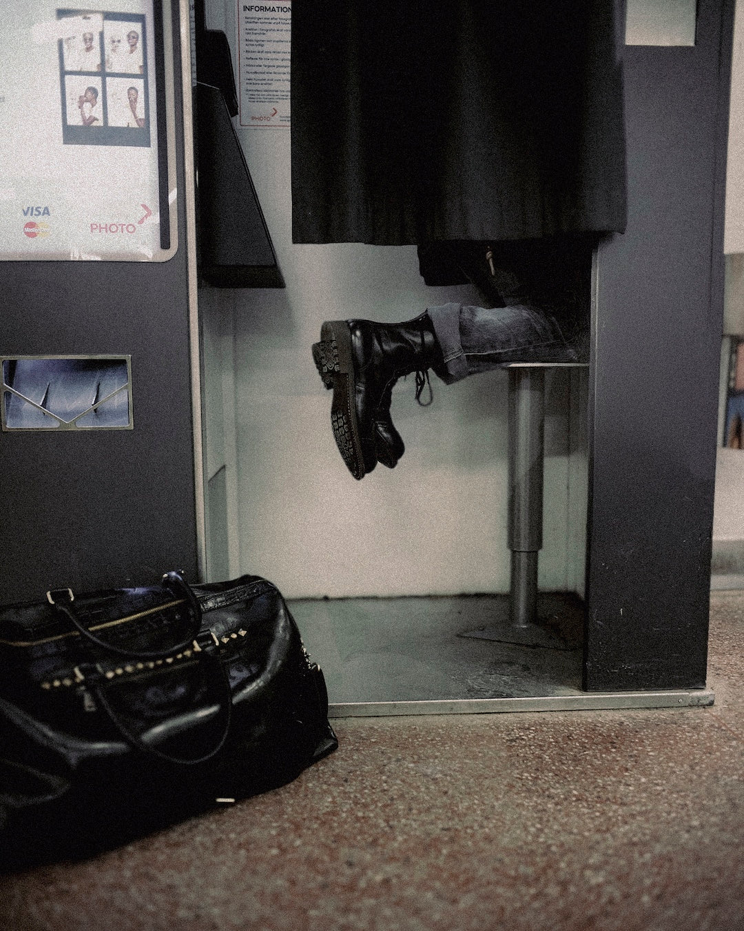 Photobooth session person on knee on stool facing backwards in Bum Society boots