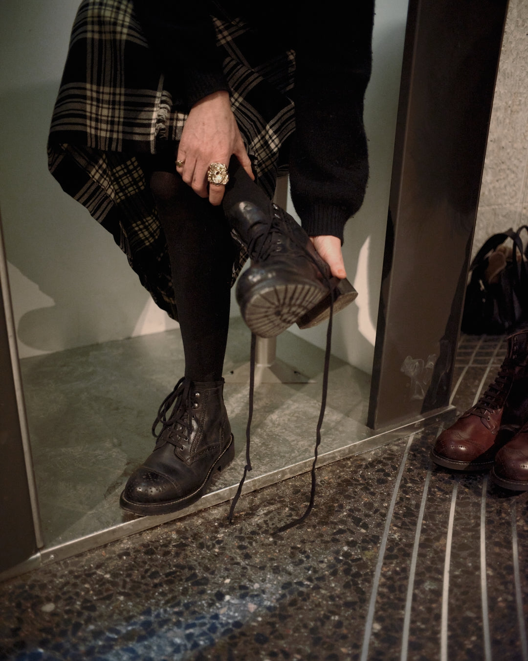 Photobooth session changing Bum Society boots in booth