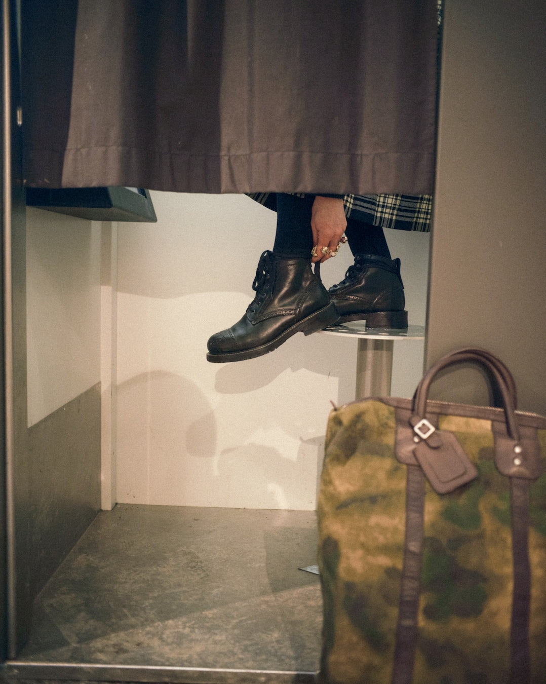 Photobooth session person balancing on stool in Bum Society boots